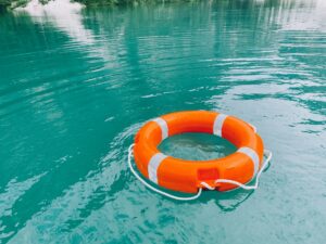 Safety buoy on emerald green water